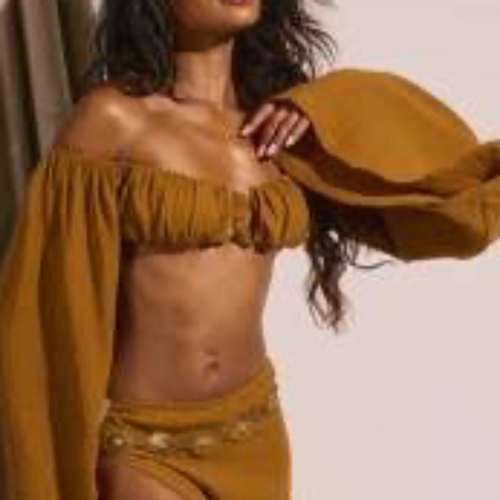 Top with matching skirt sold separate